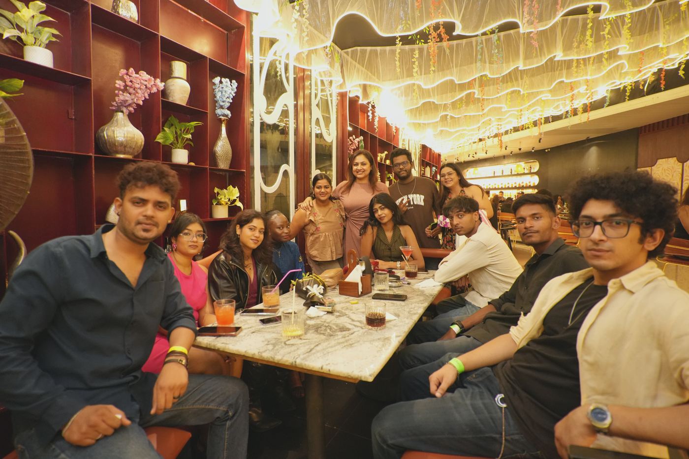 Friends sharing dinner at Ellara before the party
